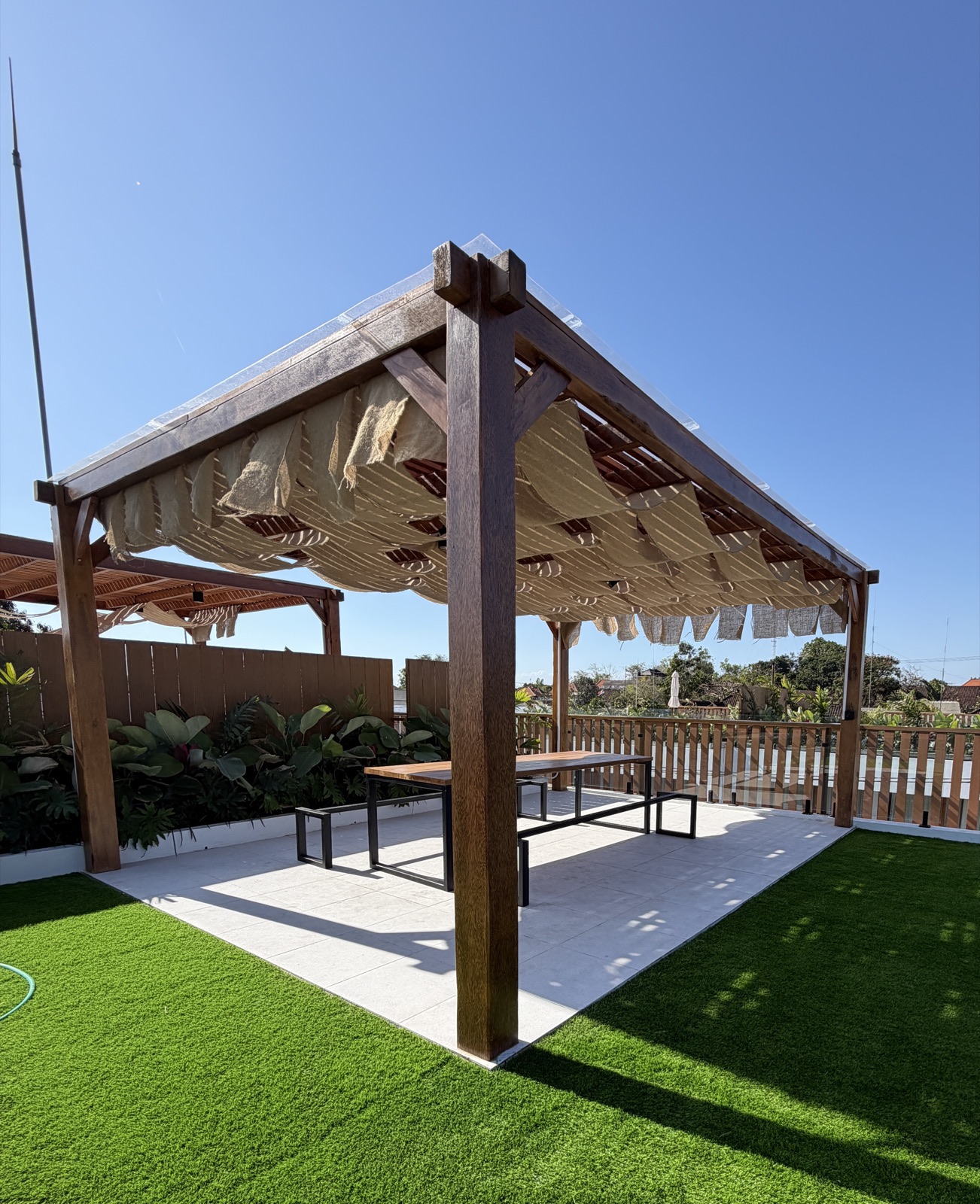Rooftop pergola lounge with dining table