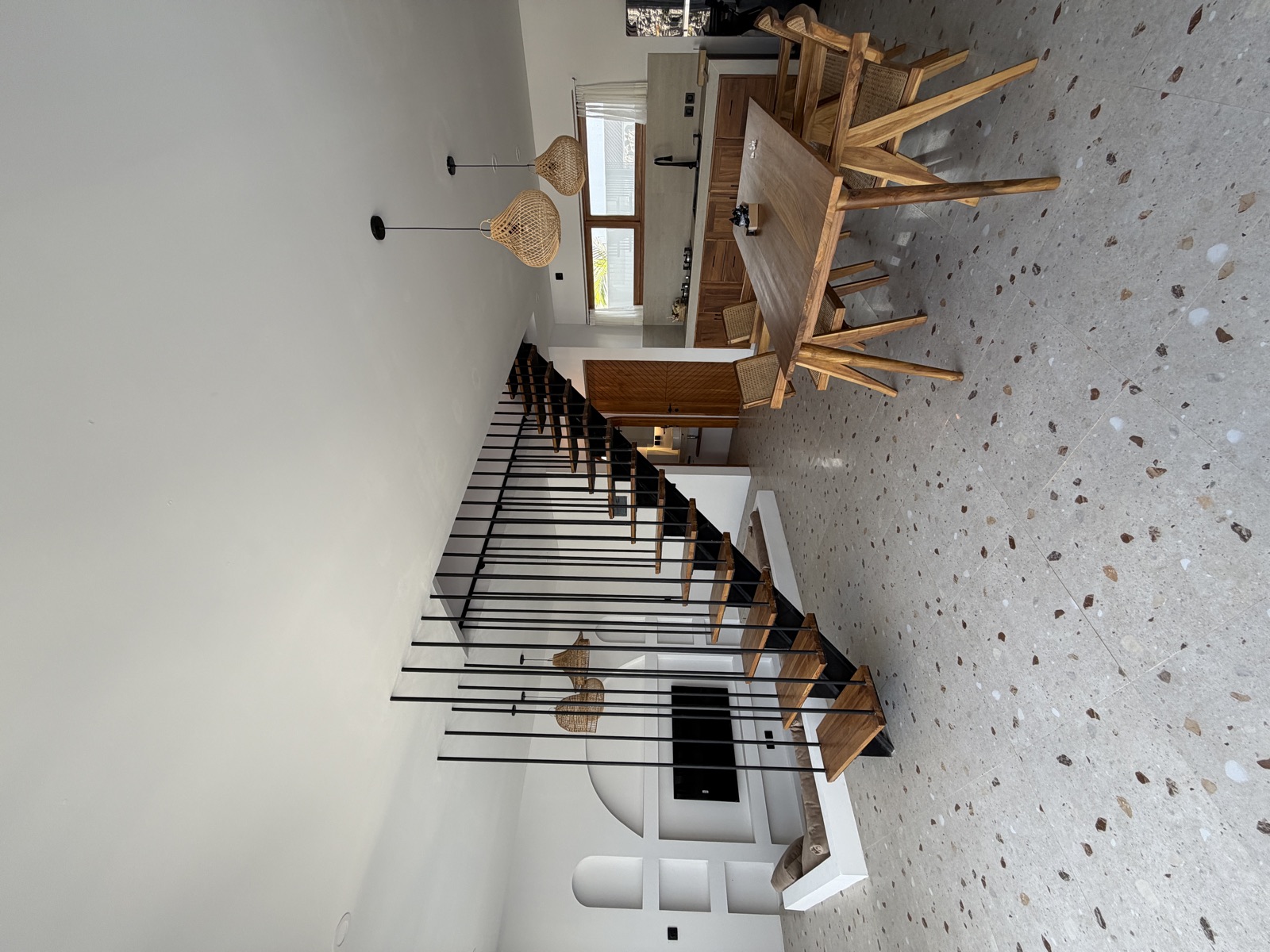 Open living and dining area with staircase