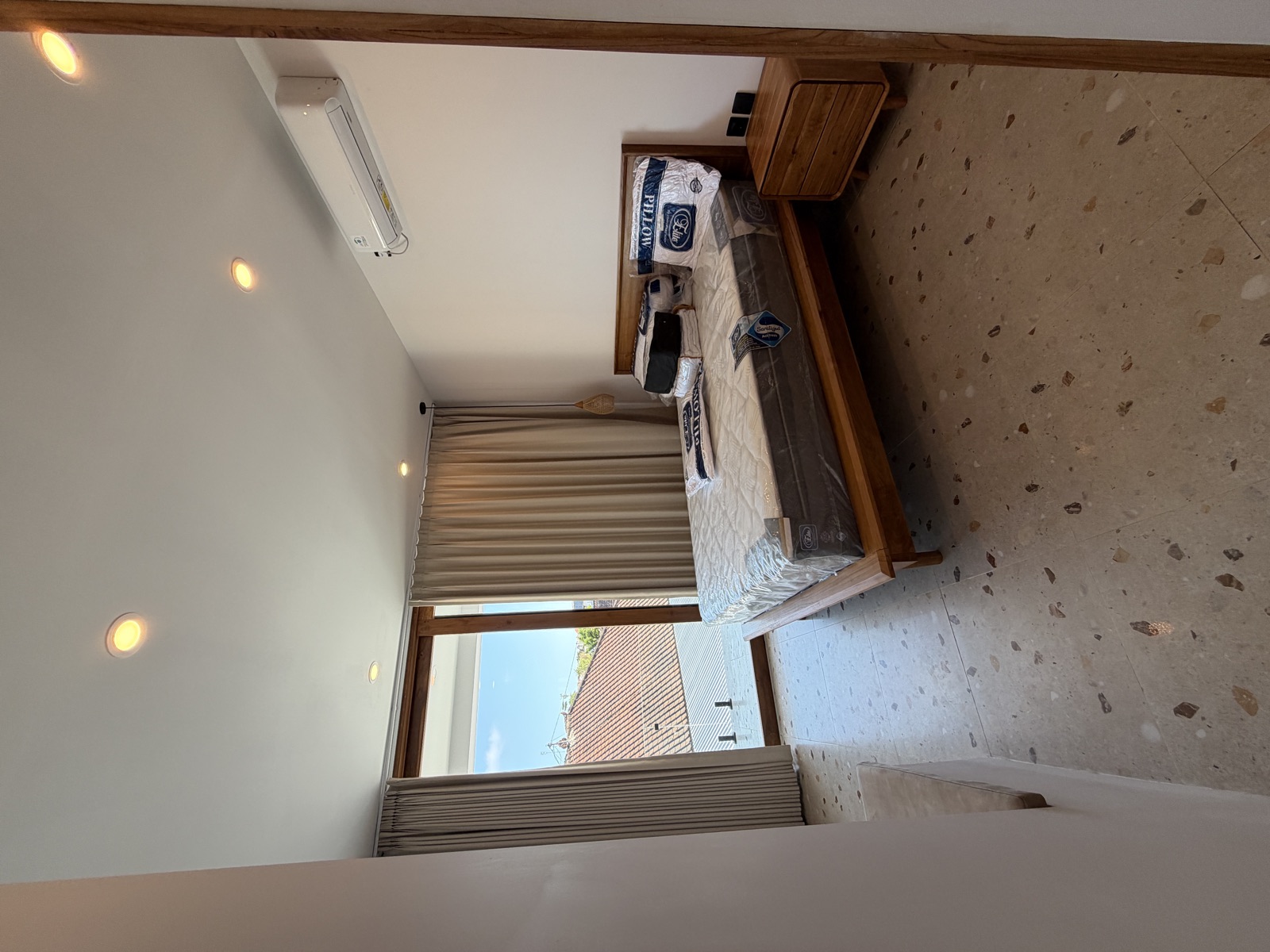 Bedroom with balcony view